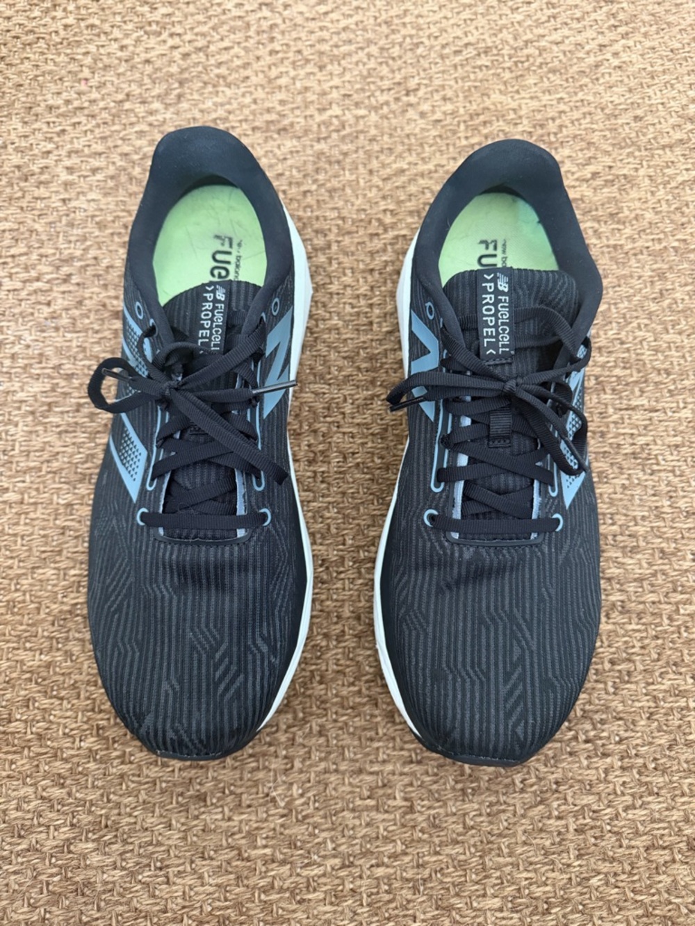 New Balance Black Running Shoes with Light Blue Accents